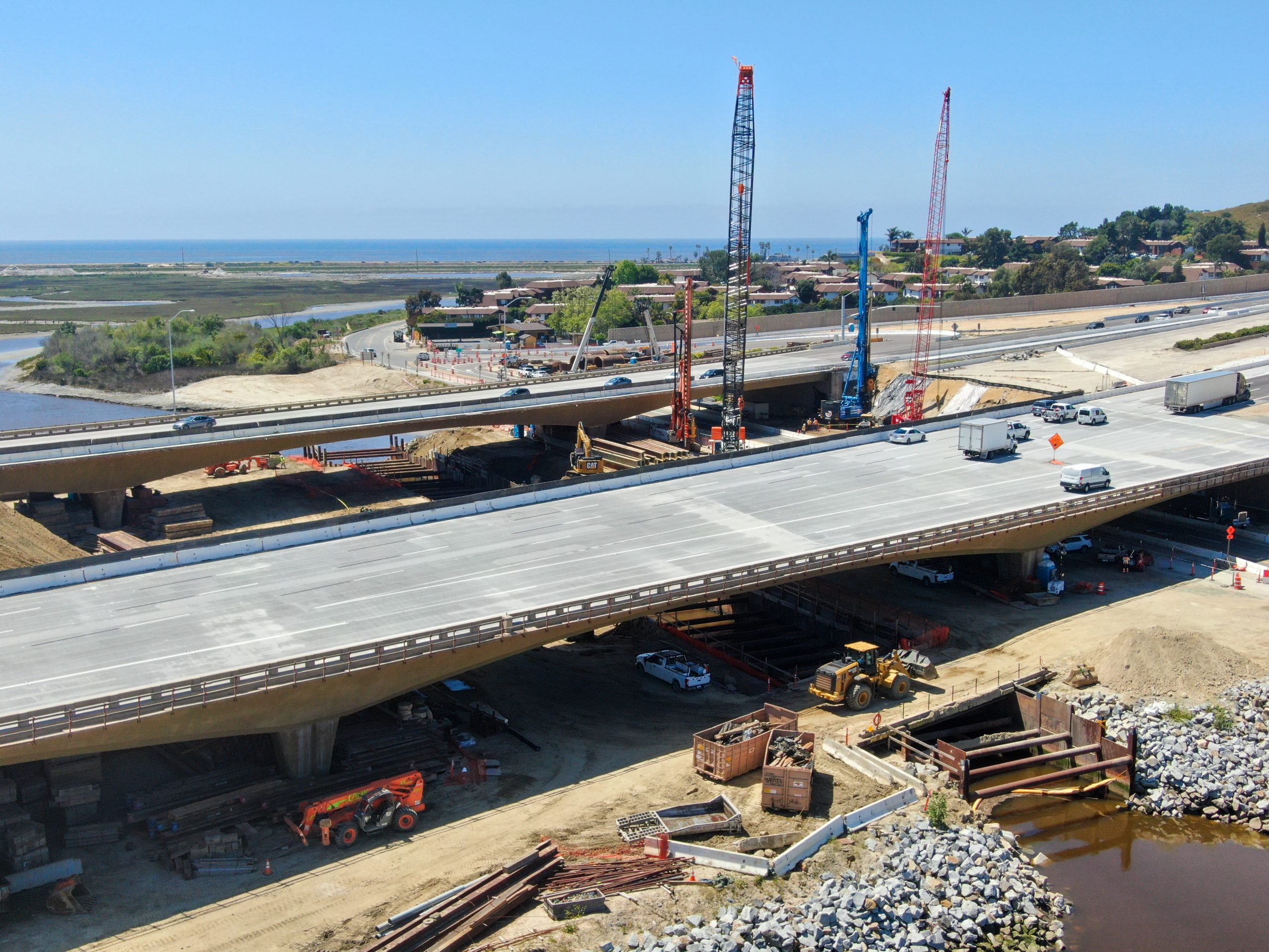 Aerial view of highway bridge construction over small river Aerial view of highway bridge construction over small river, San Diego, California, USA