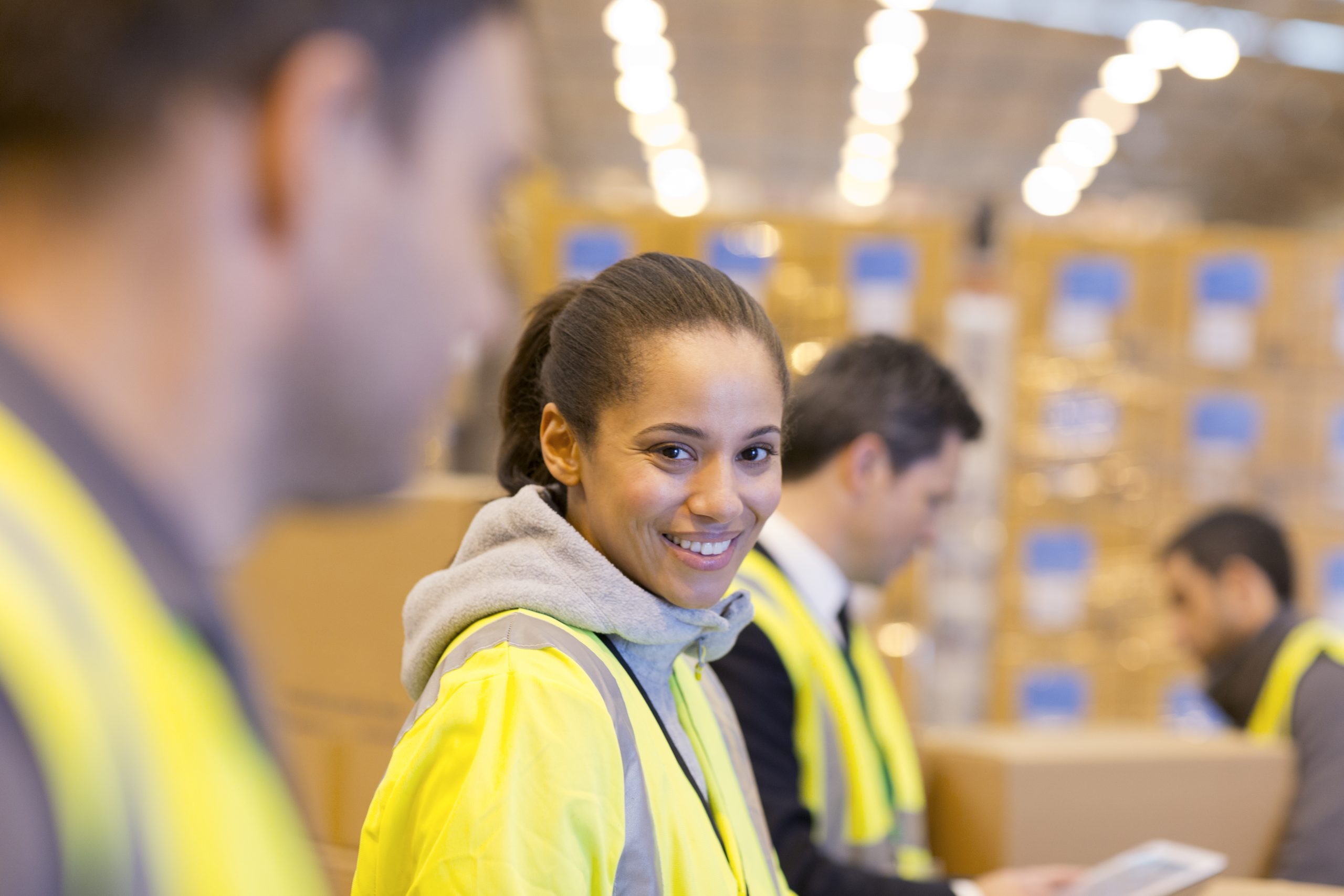 Worker smiling in warehouse