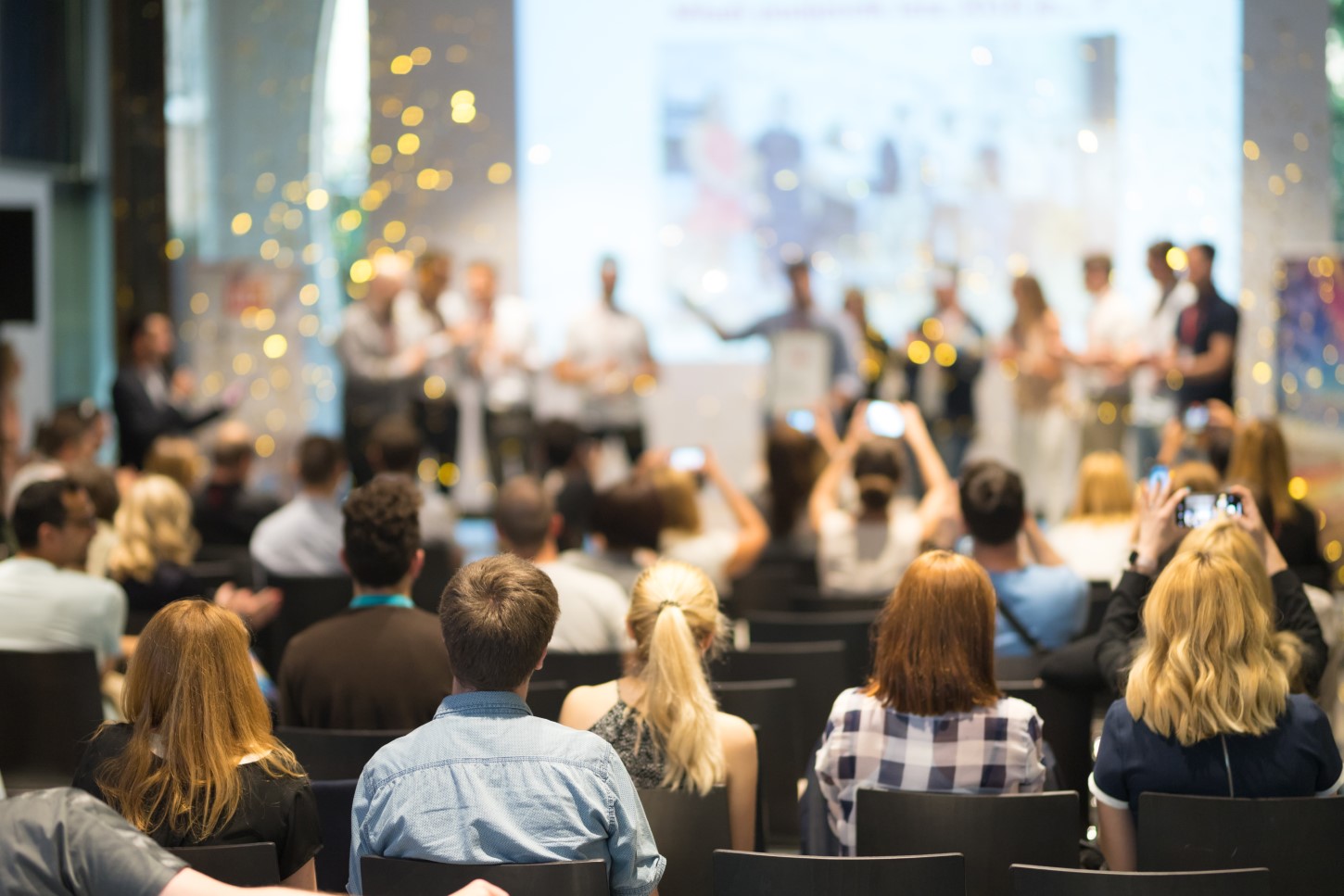 Company employees gathered for a recognition event celebrating team achievements and cultural transformation success